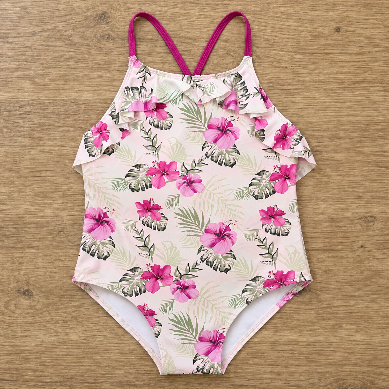 Maillot de bain une pièce enfant rose motifs feuilles de palmier et hibiscus